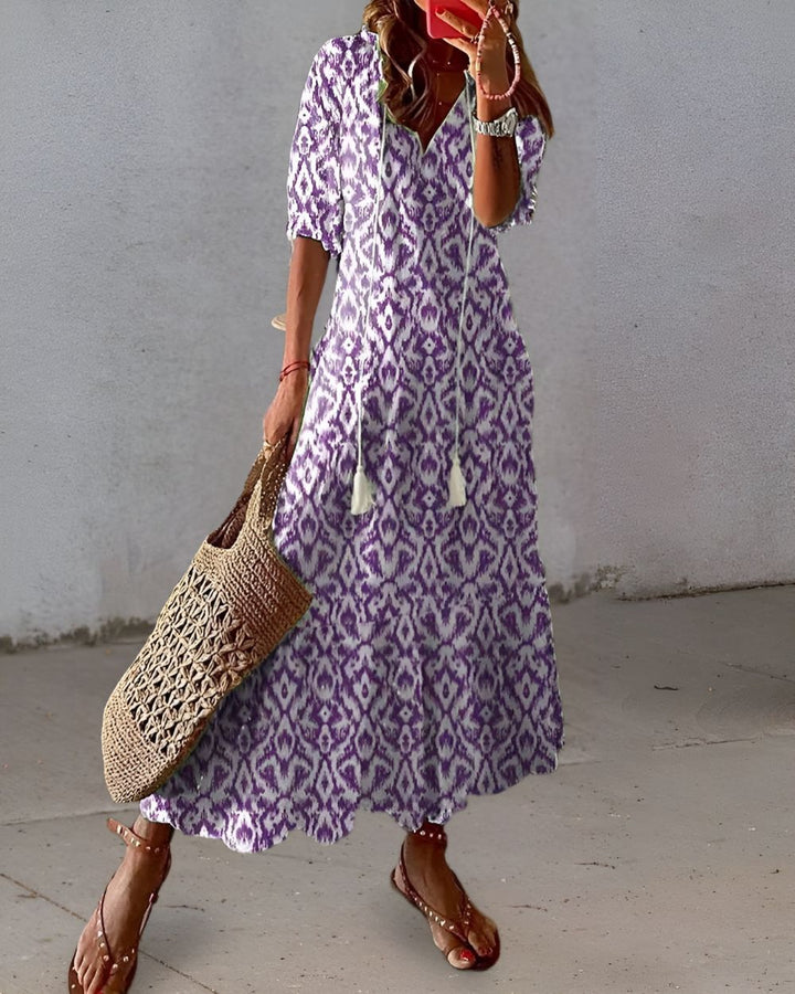Flowy bohemian maxi dress for women, featuring comfortable relaxed fit & adjustable spaghetti straps.