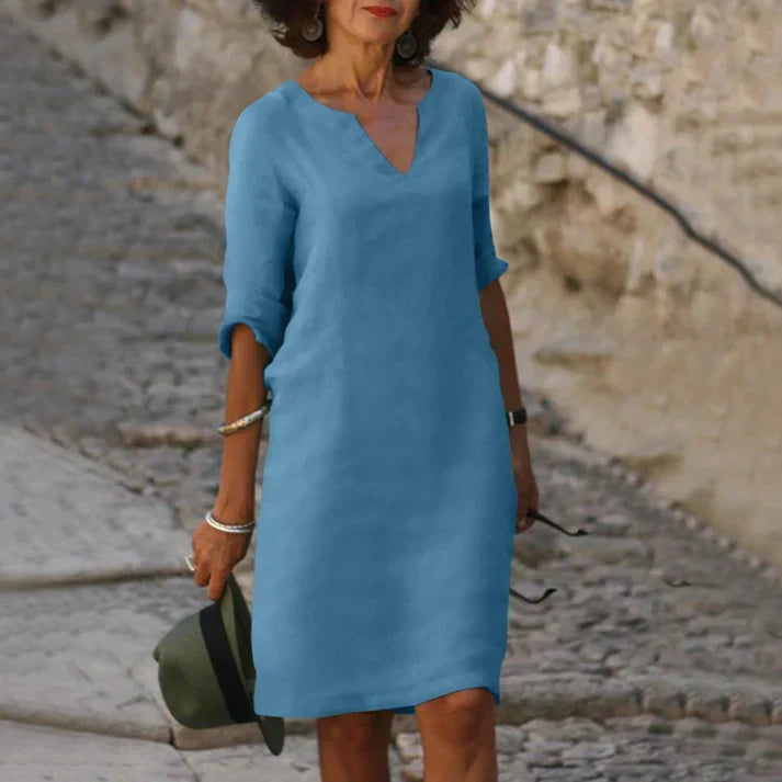 Trendy women's fashion: V-neck midi dress with short sleeves, breezy & flowy for a stylish, comfortable summer.