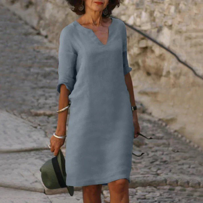 Comfortable day dress for women: breezy V-neck midi with short sleeves. Flowy design, perfect for casual elegance.