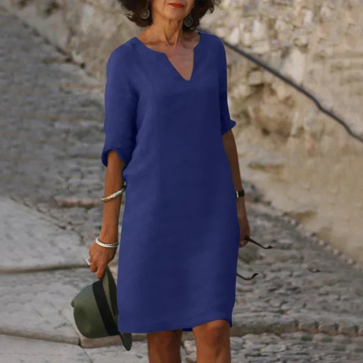 Must-have women's V-neck midi dress for summer. Breezy, short-sleeve, flowy, and comfortable for any occasion.