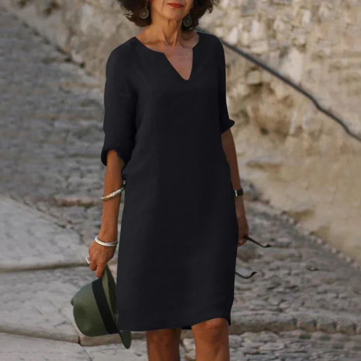 Comfortable & chic women's V-neck midi dress. Short-sleeve, breezy, and flowy for elegant, casual summer fashion.