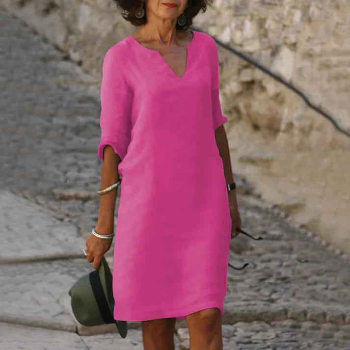 Elegant women's V-neck midi dress with short sleeves, ideal for vacation, summer, or day outings. Breezy & flowy.