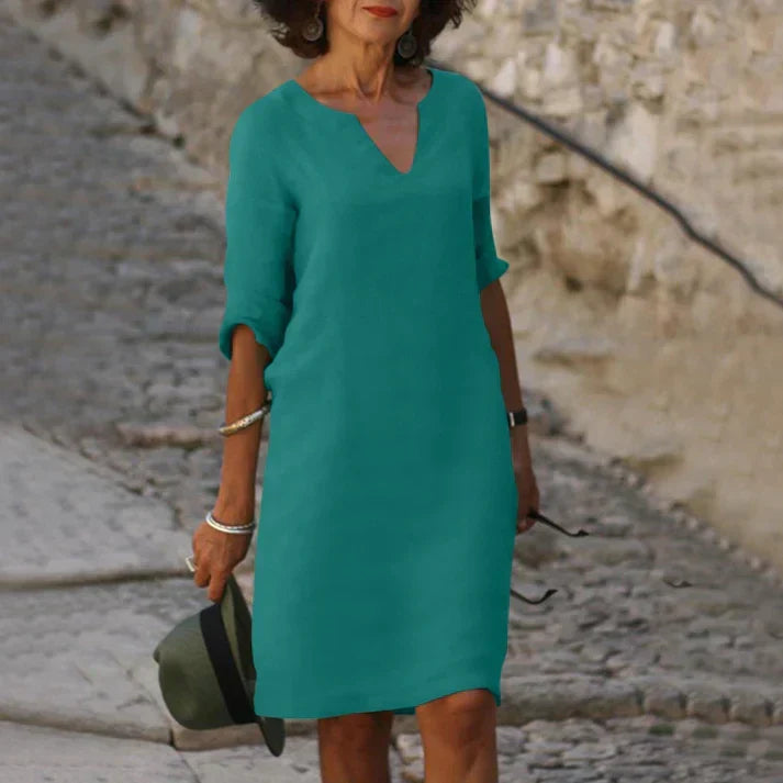 Vacation-ready women's breezy V-neck midi dress. Short-sleeve, flowy design for ultimate summer comfort & style.