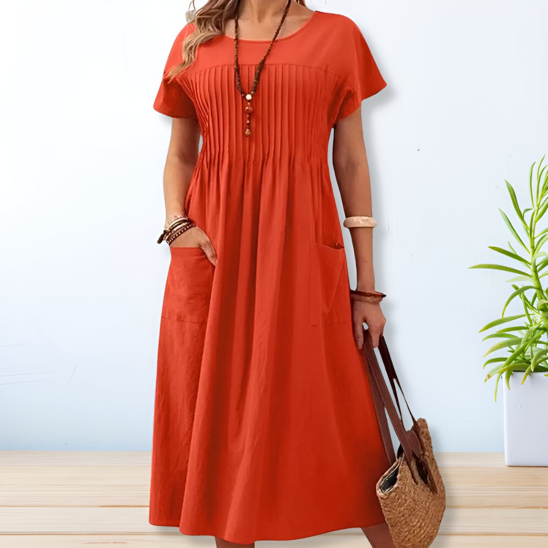 Modest women's midi dress with practical pockets, a versatile casual summer dress for everyday comfort.