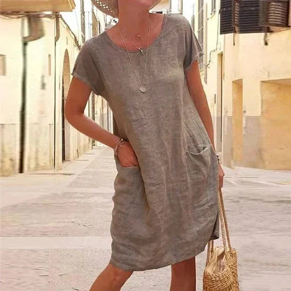 Comfortable women's midi dress, short sleeves, and pockets for casual summer wear and relaxed everyday style.