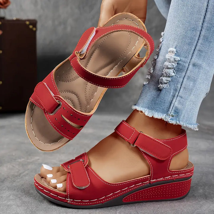 Cushioned women's wedge sandals with adjustable straps, ideal for comfortable casual walking and everyday wear.