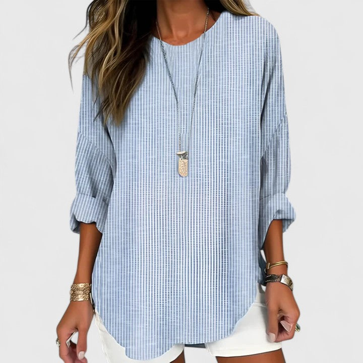Relaxed fit women's long sleeve crew neck blouse. Comfortable striped top for everyday casual style and all-season wear.