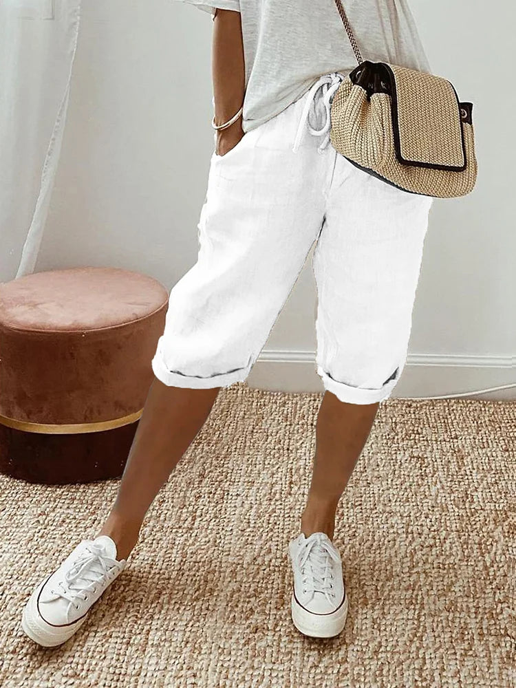 Soft cotton capri pants for women, featuring a drawstring waist & roll hem for ultimate casual summer comfort.