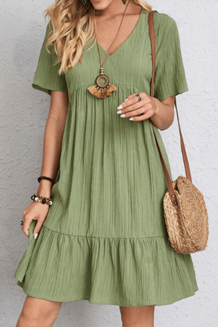 Flowy summer midi dress for women, offering relaxed comfort and timeless style for vacations.