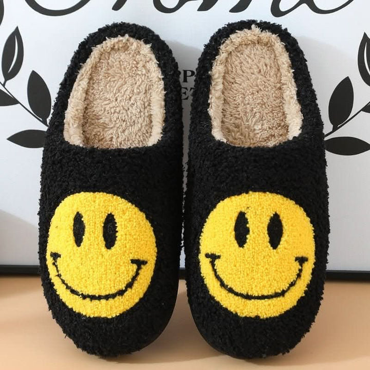 Warm and soft women's house slippers with an embroidered smiley face, ideal for chilly winter mornings.