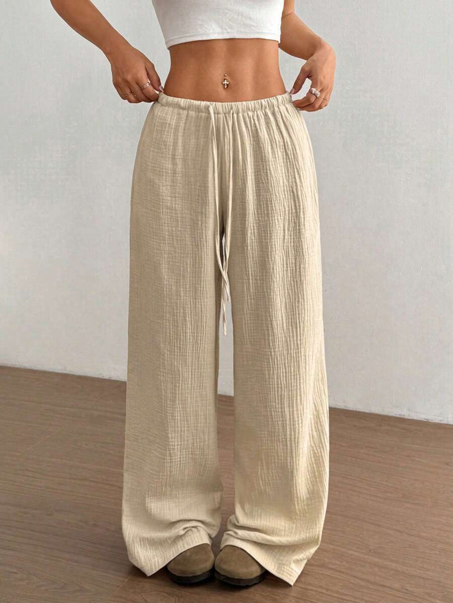 Comfortable women's wide leg crinkle pants, elastic drawstring waist for a relaxed everyday fit.
