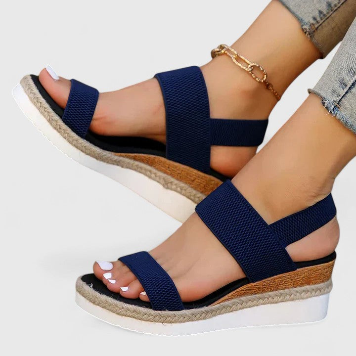 Fashionable women's open toe espadrille wedge sandals. Slip-on elastic straps offer comfort & casual summer style.