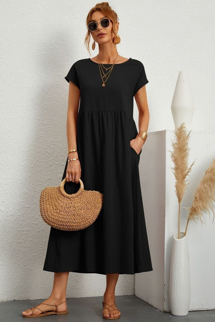 Modest pleated midi dress for women, ideal for spring & summer events. Effortless & stylish.