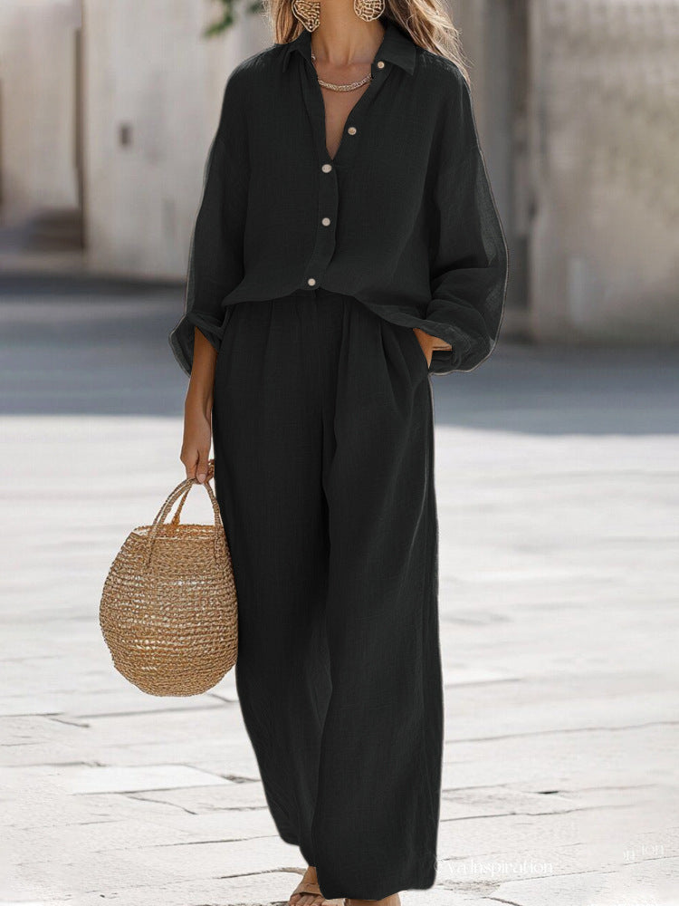 Relaxed fit women's summer outfit: a comfortable blouse and elegant wide-leg pants.