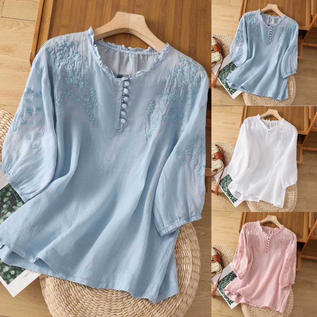 Elegant women's embroidered short sleeve blouse with a comfortable, relaxed fit and stylish button neckline for summer.