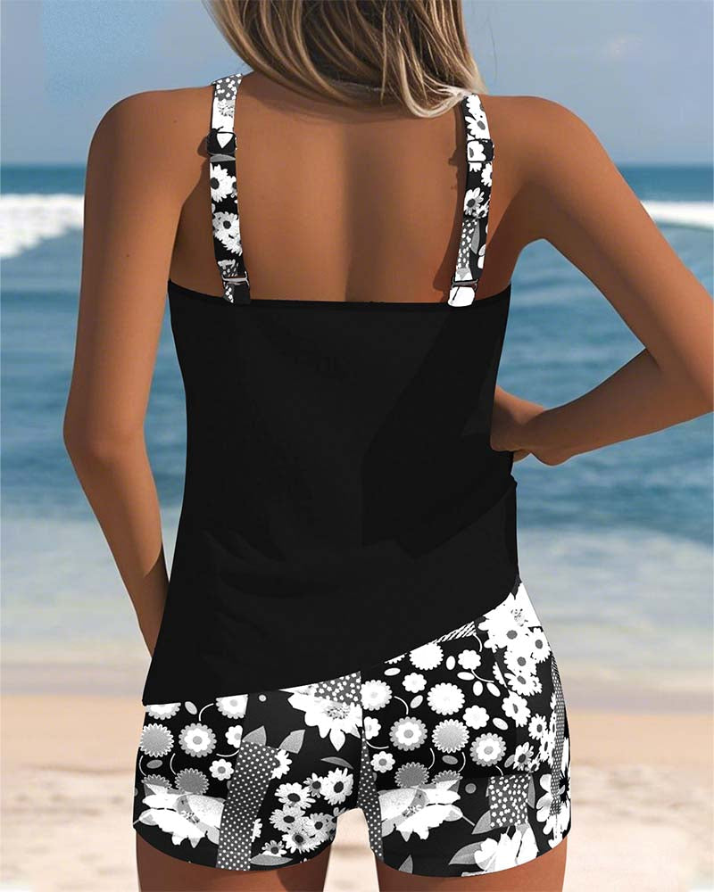 Fashionable women's floral print racerback tankini set, a stylish two-piece swimsuit for any summer outing.