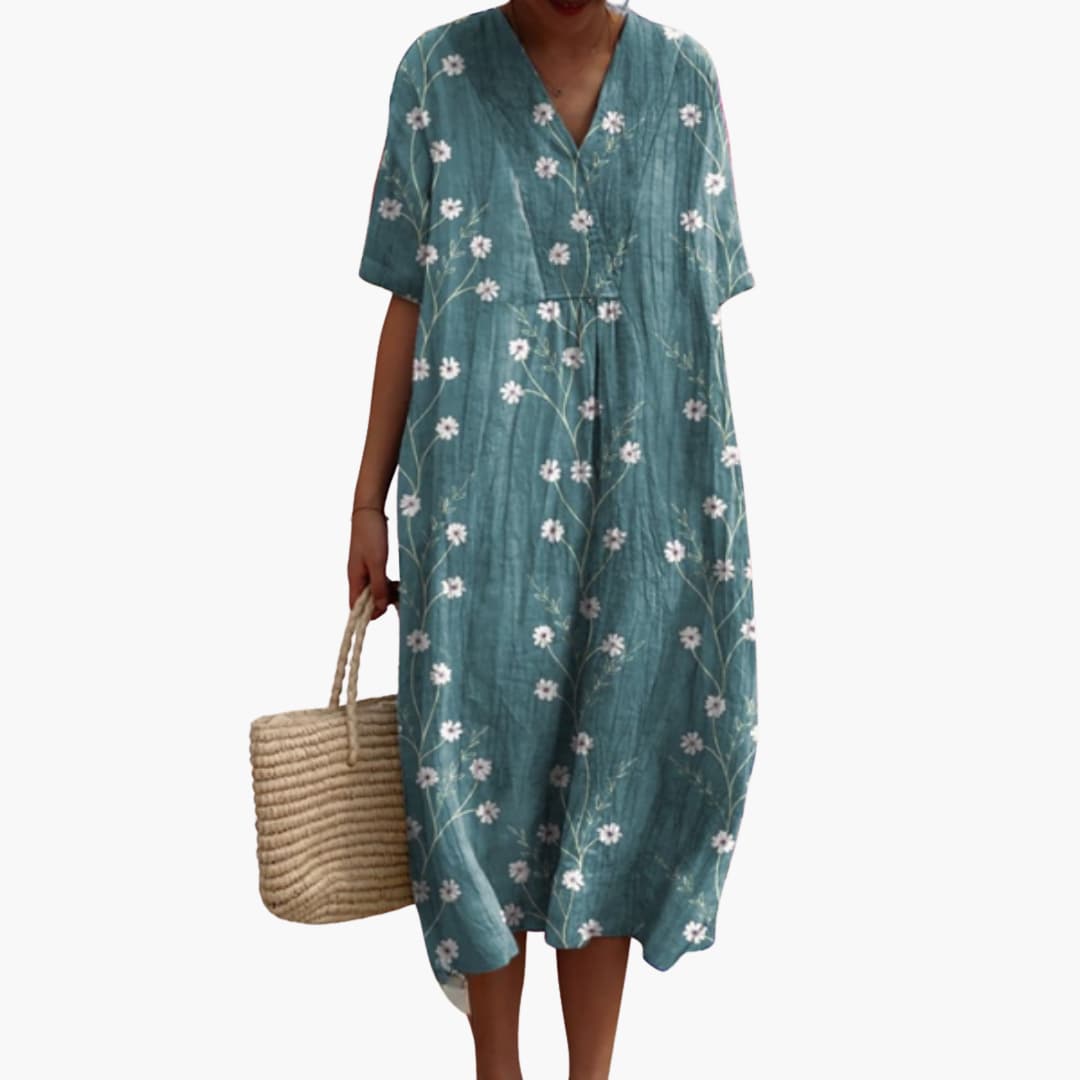 Versatile women's floral midi dress, V-neck, short sleeves, oversized, ideal for travel or daily outings.