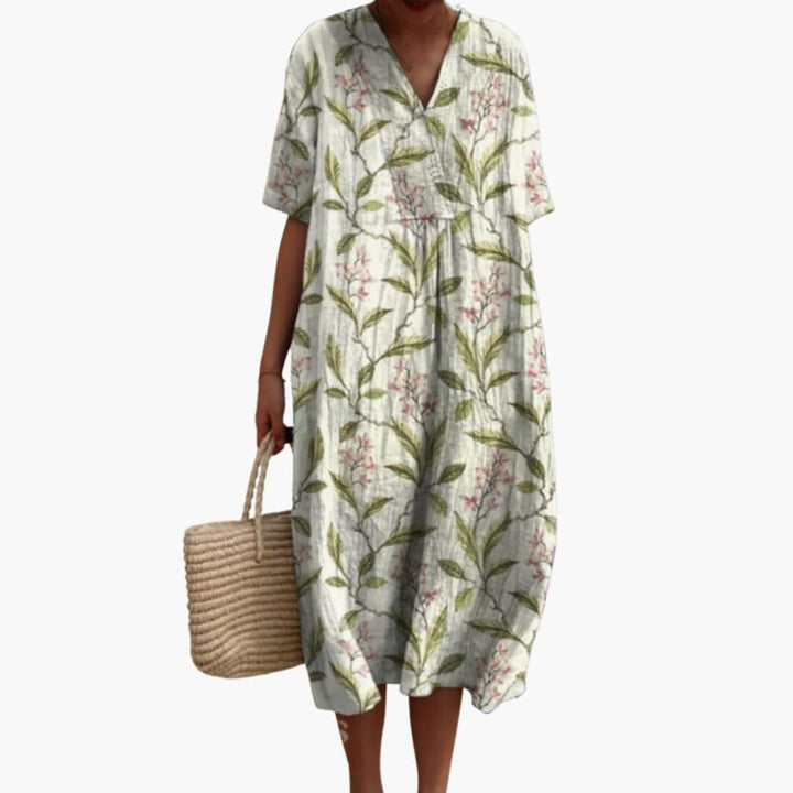Effortlessly chic women's floral midi dress, V-neck, short sleeves, oversized for ultimate summer comfort.