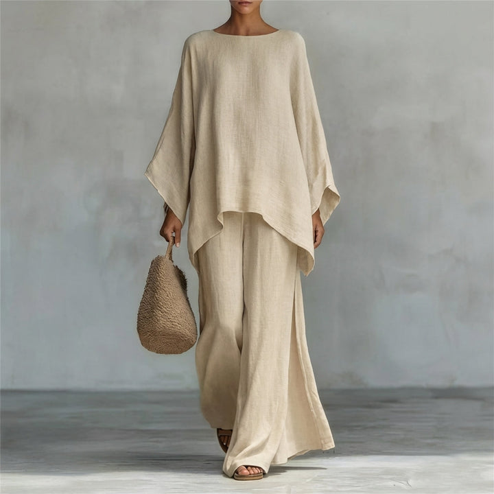 Casual chic women's summer set featuring a flowing tunic top and a matching maxi skirt for vacation.