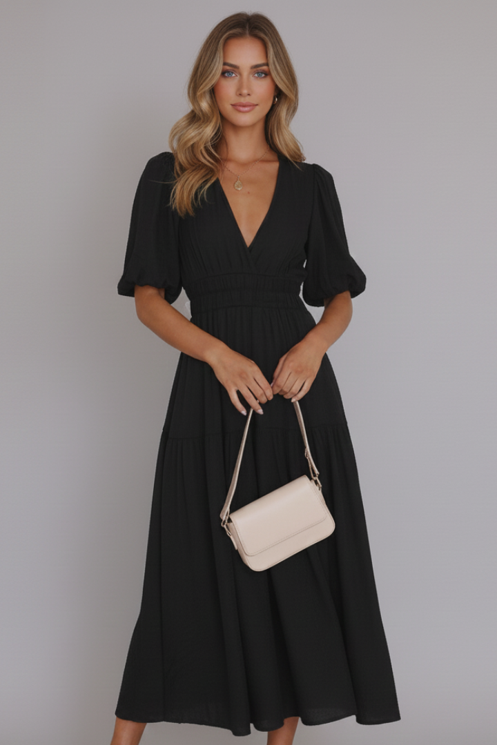 Chic women's flowy midi dress featuring a flattering V-neck and stylish tiered hem for all occasions.