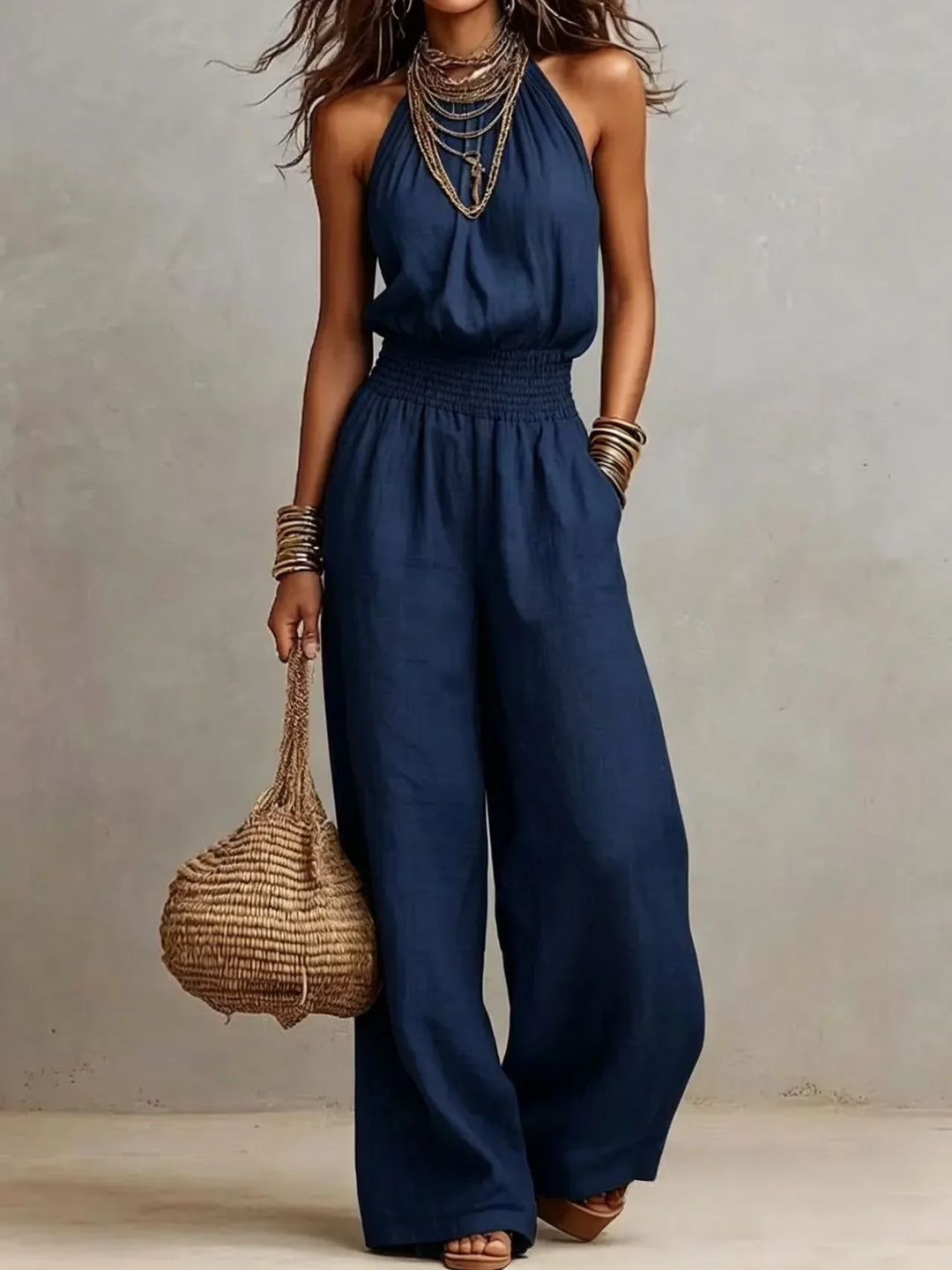 Comfortable women's halter neck wide leg jumpsuit, an essential summer outfit for relaxed or elegant occasions.