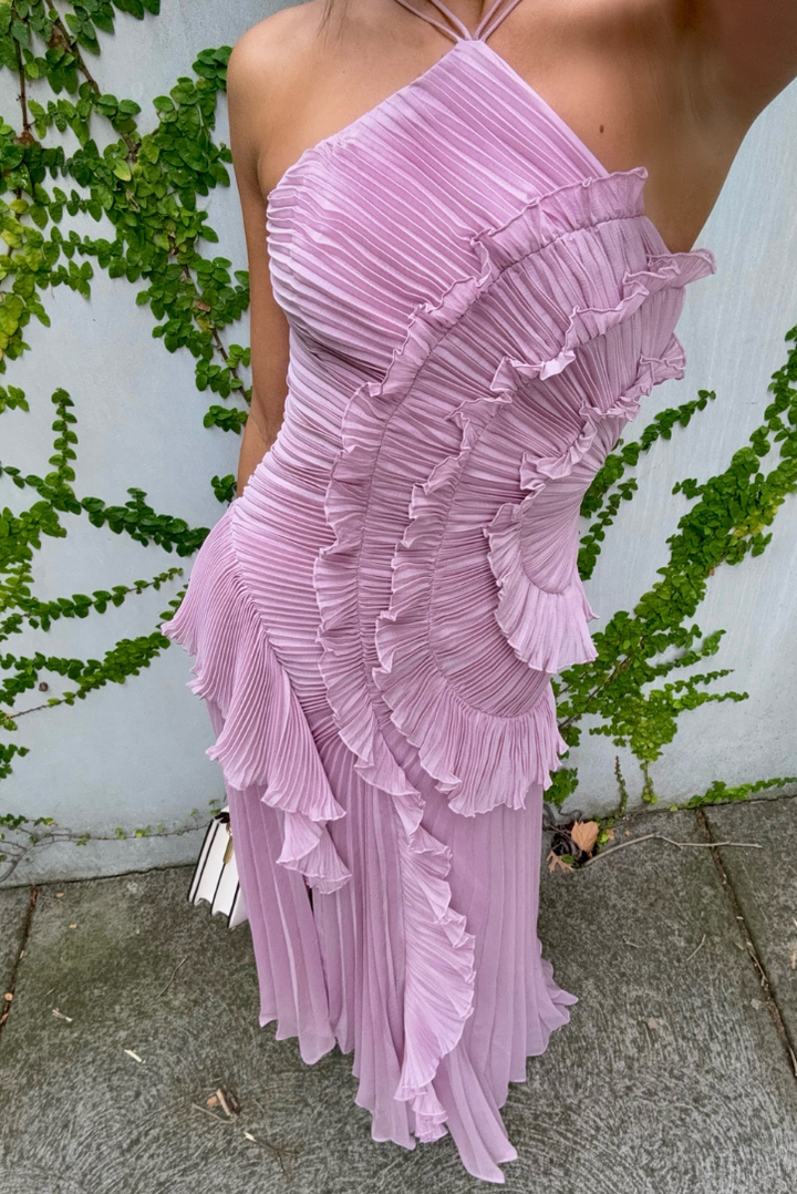 Front view of a women's lilac pleated ruffle halter homecoming dress. Features a chic halter neckline & midi length.