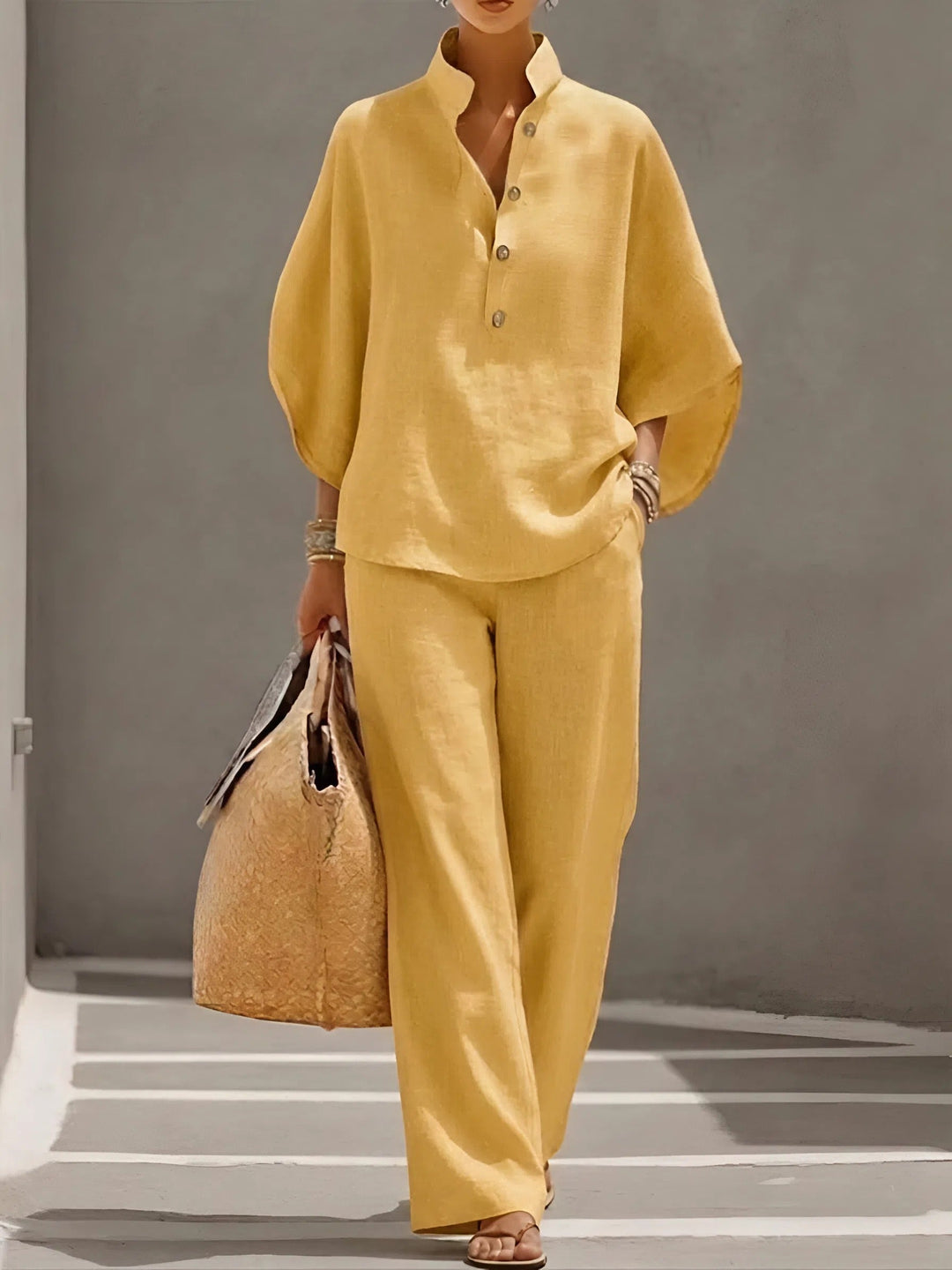Chic women's resort wear set with mandarin collar top & wide leg pants, perfect for elegant casual looks.