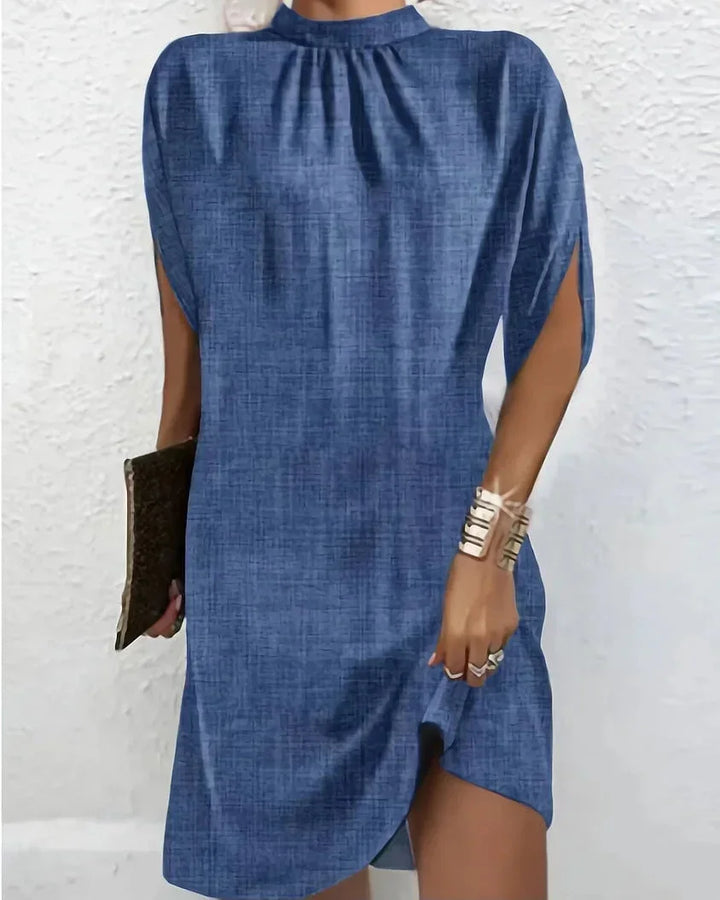 Sleek & elegant women's mock neck mini dress with sophisticated cape split sleeves, perfect for parties.