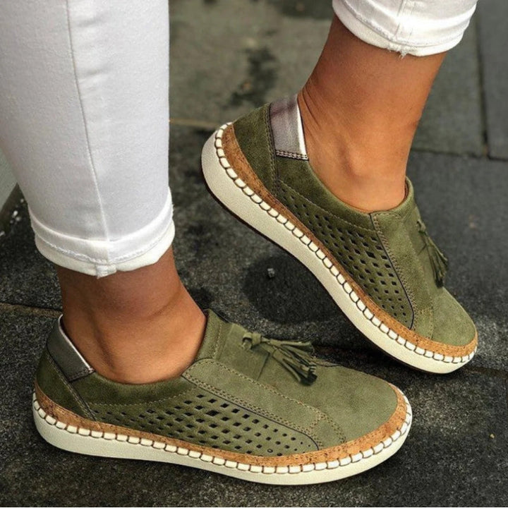 Women's orthopedic slip-on shoes with arch support & breathable comfort. Ideal for walking & casual wear.