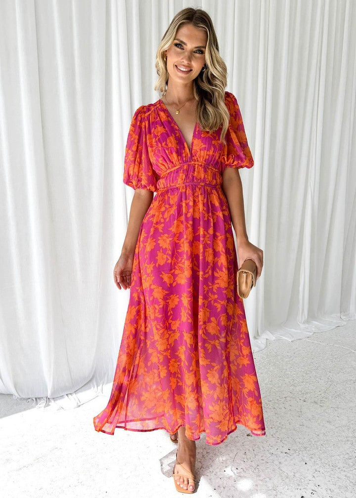 V-neck pink orange floral maxi dress for women, featuring puff sleeves & a flowing elegant silhouette.