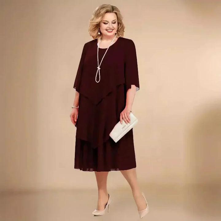 Women's plus size formal dress with asymmetrical hem, ideal for elegant events.