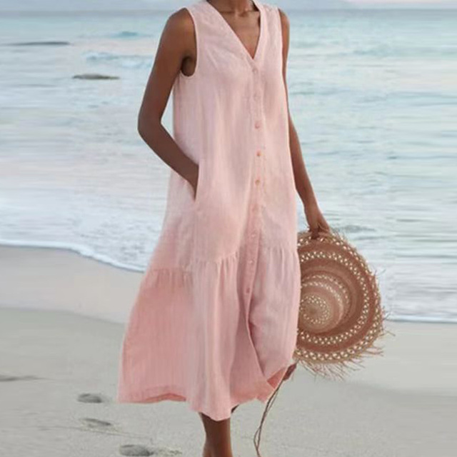 Woman wearing a chic sleeveless V-neck midi dress with front buttons, showcasing its comfortable and versatile design.