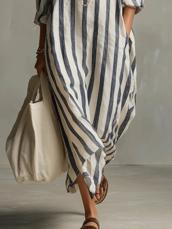 Stylish women's striped oversized maxi dress, modern design, casual everyday fashion.