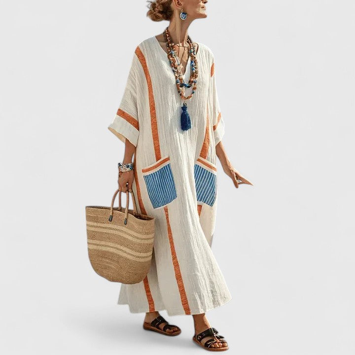 Elegant striped V-neck maxi dress for women, offering a long, flowy silhouette and practical pockets.