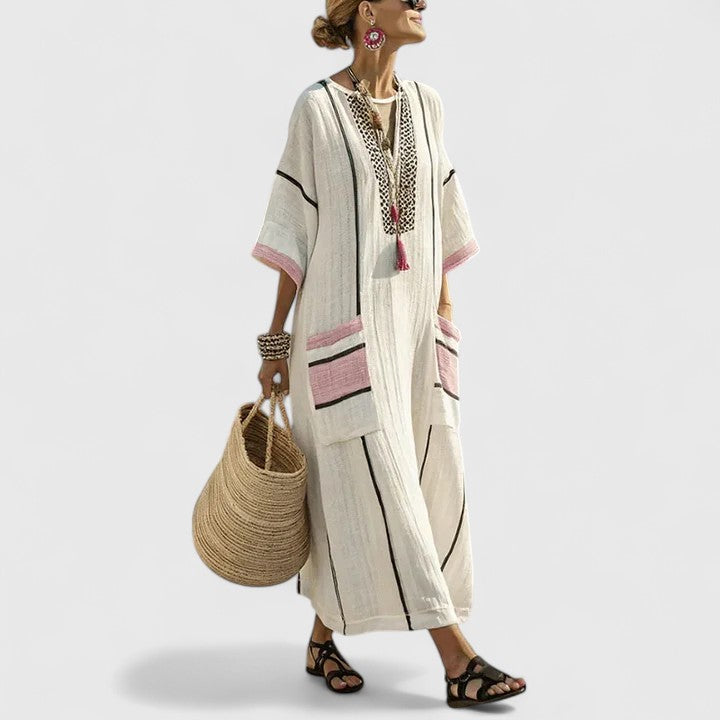 Chic V-neck striped maxi dress for women, featuring a flattering neckline and functional pockets.