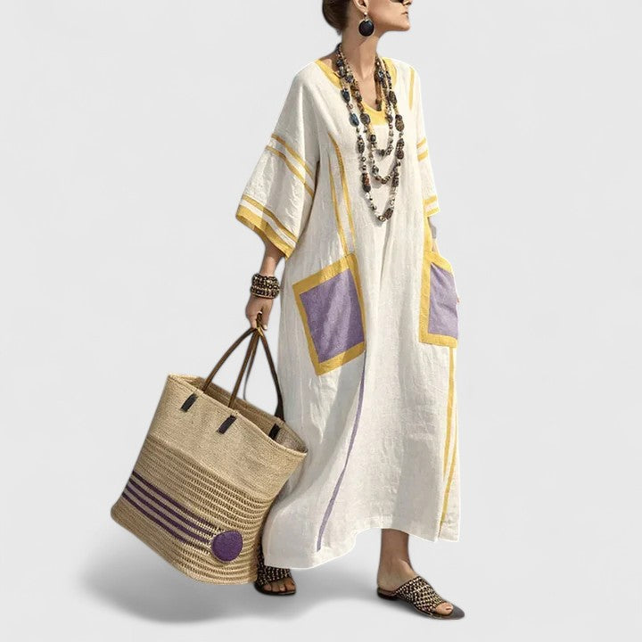 Relaxed bohemian striped V-neck maxi dress for women, with a comfortable flowy fit and essential pockets.