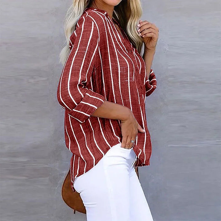 Breathable striped V-neck summer shirt for women, relaxed fit, essential for casual warm-weather style.