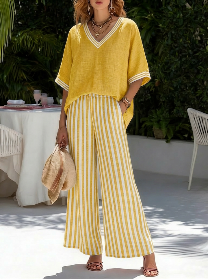 Versatile women's striped matching set: V-neck top & wide leg pants for casual outings or a relaxed vacation.