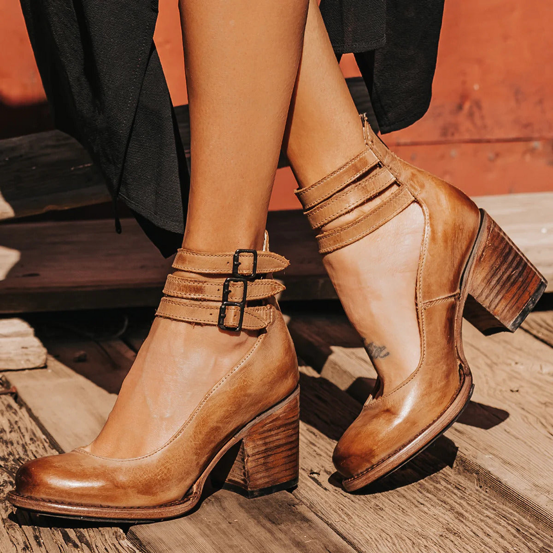 Comfortable women's round toe pumps with a stable block heel and secure ankle strap.
