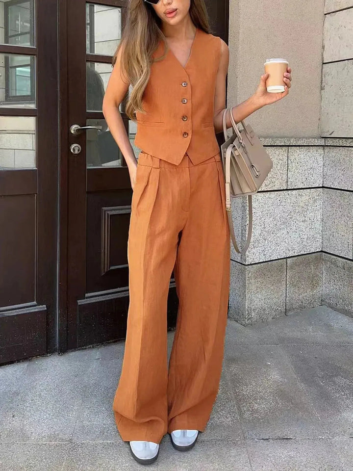 Stylish women's tailored waistcoat & wide leg trouser set. An elegant two-piece for summer fashion, smart casual or office wear.