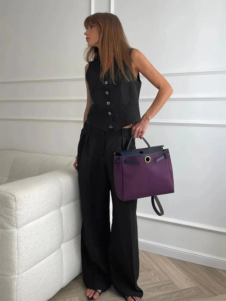 Summer fashion women's tailored set featuring a stylish waistcoat & wide leg trousers. Chic, elegant two-piece for women.