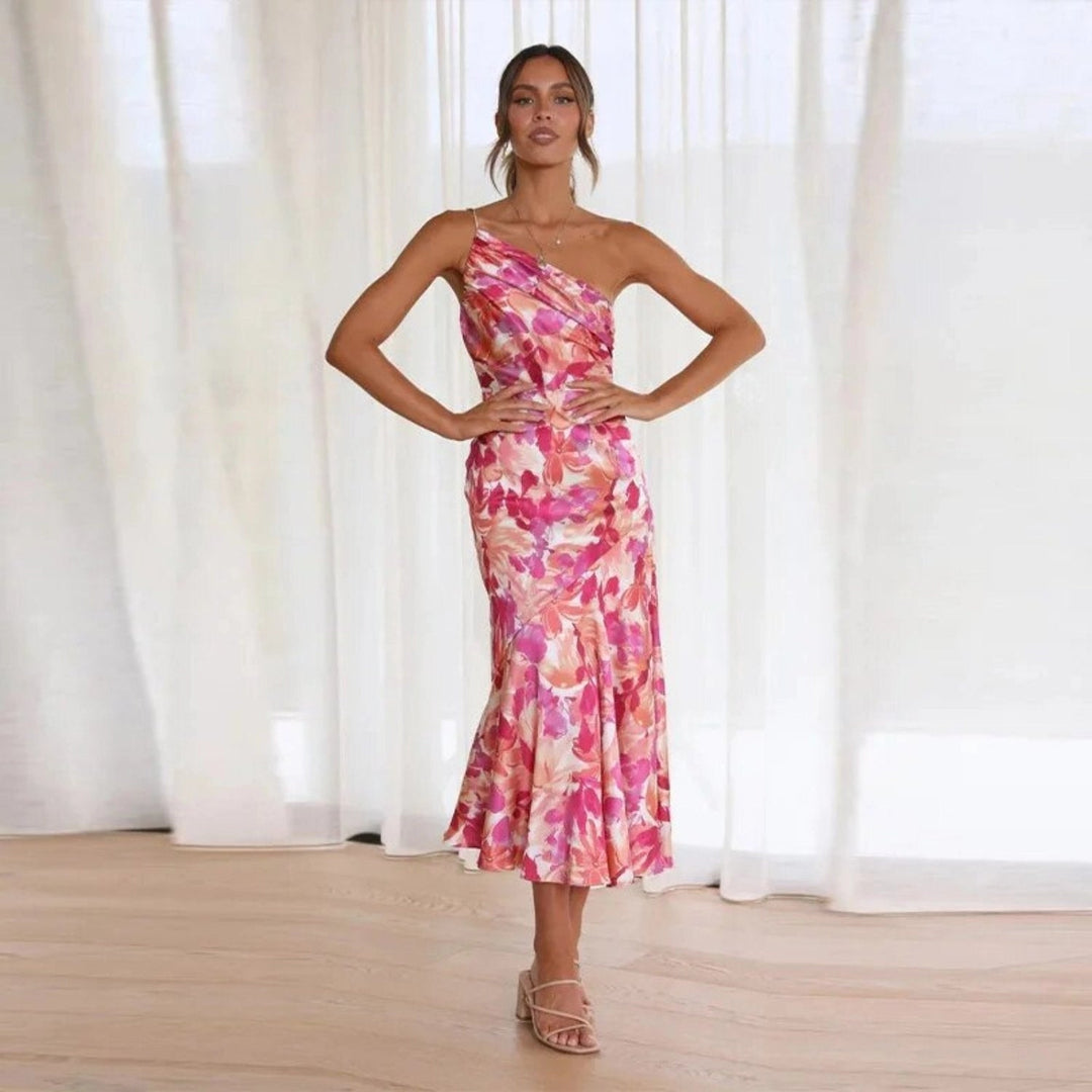 Chic women's floral asymmetric midi dress, sleeveless, flowing hem, ideal for special occasions.