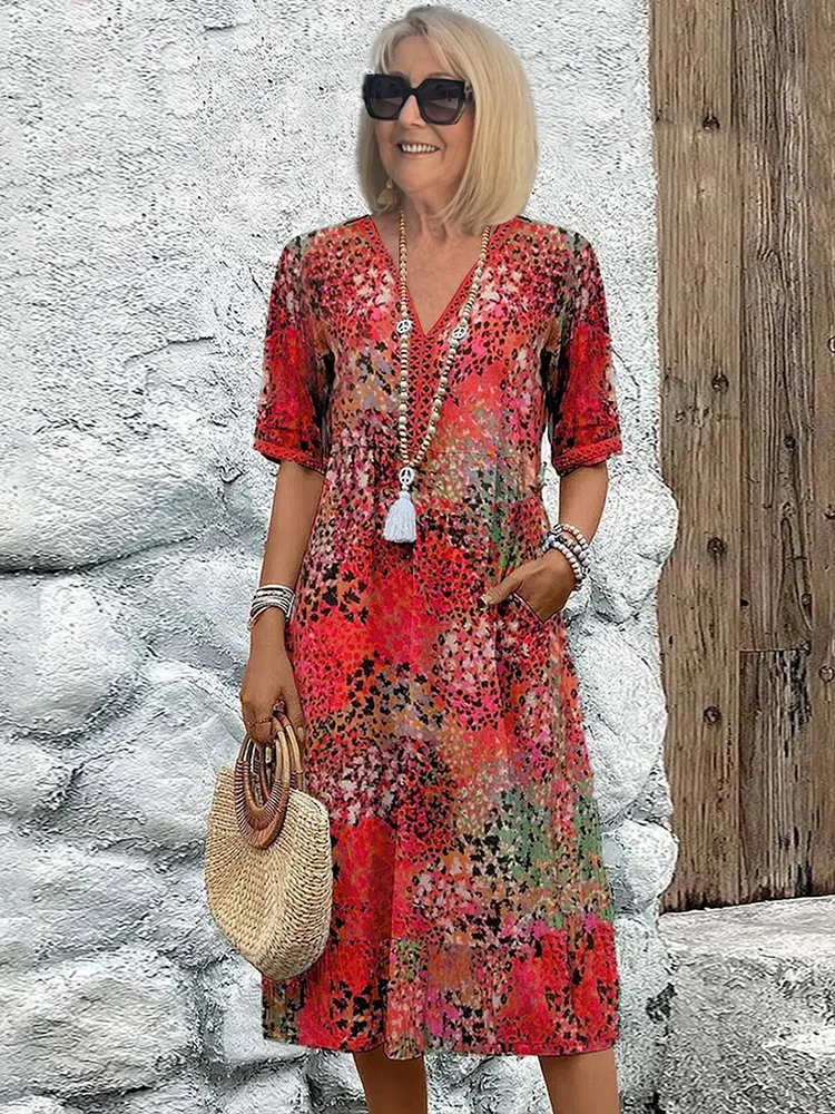 Women's vibrant print flowy midi dress. Perfect for spring & summer casual elegance or party wear.