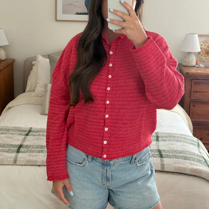 Soft long-sleeve women's cardigan, designed with a classic striped motif and easy button front.
