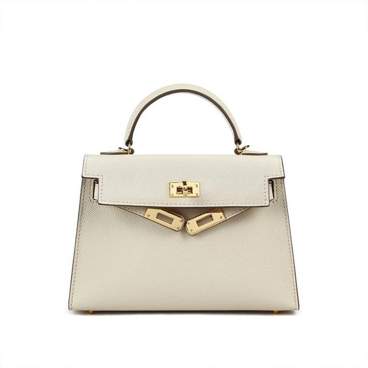 Chic brown women's shoulder bag, structured design with a top handle & secure turn lock, ideal for fashion.