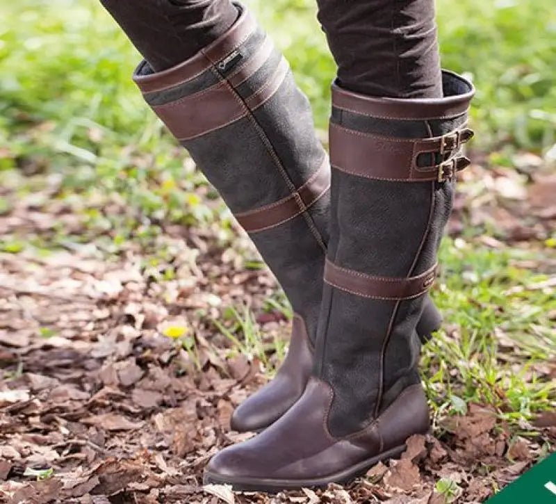 Women's knee-high pull-on waterproof boots. Stylish and comfortable for all-weather country wear, durable protection.